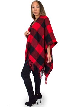 "This cozy chic knit poncho features a bold buffalo plaid print with fringe trim, and lightweight, flowing material that is comfortable and warm. Wear with your favorite boots for a stylish, yet casual look on chilly days. Material: 100% Acrylic Sizing: One size fits all Garment Measurements: 46\" x 55\" Model Measurements: Bust: 32\" Waist: 26\" Hips: 36\" Height: 5'5 See more colors and prints here: https://www.etsy.com/shop/DaisyDelSolDesigns?section_id=24478765 We are taking steps towards su Sweater Blanket, Designer Inspired Handbags, Fleece Poncho, Plaid Shawl, Red And Black Flannel, Plaid Poncho, Poncho Wrap, Black Flannel, Blanket Sweater