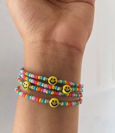 Rainbow with yellow smiley Rainbow Bracelet Beads, Fun Smiley Face Bracelets, Casual Adjustable Smiley Face Friendship Bracelets, Multicolor Casual Smiley Face Bracelets, Casual Adjustable Smiley Face Bracelets, Casual Adjustable Smiley Face Bracelet, Casual Multicolor Smiley Face Bracelet, Fun Round Beaded Smiley Face Bracelets, Fun Smiley Face Round Beads Bracelets