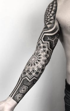 a man's arm with an intricate tattoo design on the left side of his arm