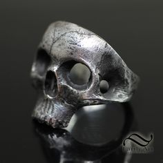 The Skull ring, A simple yet powerful look. Each one is hand carved, cast and then refined again to achieve the desired look. For this reason, there will be subtle differences in each ring. These take Time, please allow 1-2 weeks for your order to ship as I will make your ring to order in your size. Please select from the list of options: 1. Ring Size 2. Ring Metal Metal: Please select from Sterling Silver, 14k white gold or 14k yellow gold. These rings are heavy and thick. I do not skimp on my materials nor do I hollow out my rings. Interested in a larger size, or a different type of metal? Please just send me a message. Please allow several weeks for me to custom make your ring. These rings are a special order and cannot be exchanged however, I can resize them if needed. Shipping will in Symbolic Hand Forged Sterling Silver Rings, Sterling Silver Skull Ring Hallmarked, Classic Sterling Silver Hand Cast Rings, Classic Hand Cast Sterling Silver Rings, Hand Cast Silver Skull Promise Ring, Classic Sterling Silver Skull Ring With Polished Finish, Hand Forged Sterling Silver Rings For Formal Occasions, Classic White Gold Skull Ring In Sterling Silver, Classic White Gold Sterling Silver Skull Ring