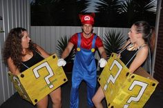 three people dressed up as mario and luigi