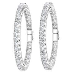 Single line 40 pointer each , 35.62 Ct Contemporary 18 Karat White Gold & Diamond Eternity Bangle Bracelet It features Two bangles crafted from 18k White gold embedded with 35.62 Carats of Round brilliant diamonds in two bangles . The pattern can be stacked with similar style bangles or worn as a stand-alone piece. Total Diamond weight 35.62 Ct Each Diamond size : approximately 40 pointer each Clarity SI1 and color G/H # of Diamonds in each bangle 44 Total # of diamonds : 88 18 K gold 61 gm Hing Single Line, Diamond Bangle, Hinged Bangle, Diamond Eternity, Diamond Sizes, White Gold Diamonds, Bangle Bracelet, Diamond Bracelet, Gold Diamond