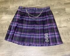 "NEW 666 Plaid Pleated Skirt Chain Charm Custom LittleBirdee Skirt Available in Small Med or Large Catholic style uniform skirt Embroidered with \"666\" Skirt is a purple, navy, black plaid Adjustable slide on hip Chain with pentagram charms Pair this up with our black 666 embroidered cardigan and ugh... so freaking cute... and spooky. Perfect for #goth #cybergoth #pastel #punk #cosplay" Purple And White Plaid Skirt, Purple Pleated Skirt, Skirt Chain, Purple Plaid Skirt, Purple Mini Skirt, Hip Chain, Punk Cosplay, Style Uniform, Punk Skirt