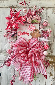 a red and white christmas wreath with candy canes