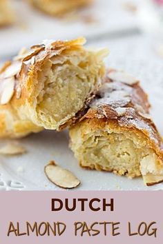 a close up of a pastry on a plate with the words dutch almond paste log