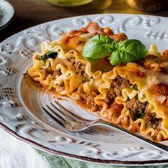 a slice of pasta casserole on a plate with a fork