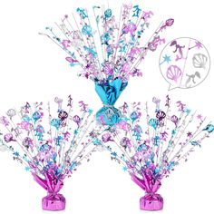 two vases filled with purple and blue flowers