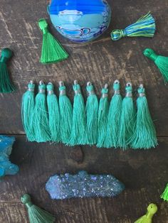 some green tassels and other items on a table