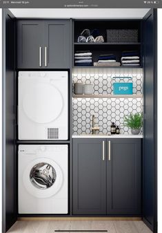 a washer and dryer in a small room with gray cabinetry, white tile backsplash, and shelves