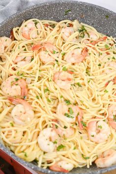 pasta with shrimp and parsley in a skillet