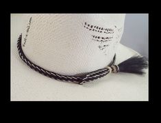 Elegant beauty Cowboy hat horsehair hat band: Multi- strand horsehair with double Side tassels Boldest ** black center with a stunning natural white whip-stitched edge Unique, distinctive and exceptional quality. Everything you want in a Horsehair hat band and MORE! Brings out your spirit in an exclusive design that is vibrant as your western lifestyle. Measurements * Longest length 26.75 inches * Shortest length about 15 inches * Width a touch over 3/8 inch wide Exceptional details *You will no Braided Western Hat Bands For Rodeo, Western Braided Hat Bands For Rodeo, Western Braided Hat Band For Ranch, Country Style Braided Hat Bands For Rodeo, Traditional White Hat Bands For Rodeo, White Southwestern Hat Bands For Country Events, Traditional White Hat For Rodeo, Traditional White Rodeo Hat, Adjustable White Hat Bands For Western-themed Events