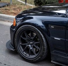 a black sports car parked on the street