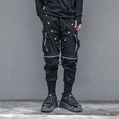 A stylish clothing that is hip hop and punk. It is fashionable, stylish, and it will look great on anyone who wears it. Do you wanahavit? Black Cyberpunk Pants For Outdoor, Cyberpunk Black Pants For Outdoor, Cyberpunk Black Outdoor Pants, Urban Cargo Pants For Winter Streetwear, Black Techwear Parachute Pants For Winter, Urban Winter Cargo Pants For Streetwear, Black Cyberpunk Pants With Side Pockets, Cyberpunk Black Pants With Side Pockets, Black Cyberpunk Parachute Pants For Outdoor