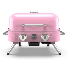 a pink grill with two burners on it