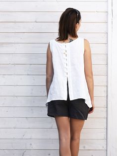 "Linen top. Its airy, soft and light, thanks to being linen. Perfect for hot days. Surprising at the back, with buttons. It is universal, idyllic and simple. Its made by Polem Po Len studio for you. Authentically handmade. Just convenient and relaxed. Pair with shorts, jeans, trousers and even underneath a cardigan DETAILS: - 100% linen, washed, softened, easy to clean  - Includes one top - Round neckline - Buttons and loops at the back - Longer on the sides - French seams - Shrinkage after the Sleeveless Summer Tops With Button Back, Sleeveless Button Back Tops For Summer, Sleeveless Linen Blouse For The Beach, Sleeveless Linen Blouse For Beach, White Linen Top, French Seam, Linen Top, Pure Linen, White Linen