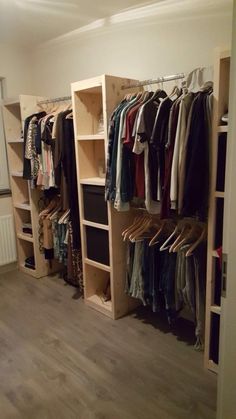 the closet is full of clothes and shoes