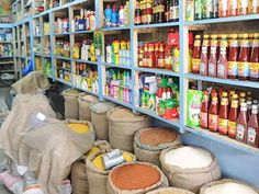 there are many bags of food on the shelves