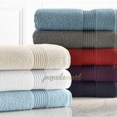 towels stacked on top of each other in different colors