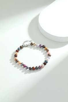 Experience the charm of our Multicolored Pearl Bracelet. Featuring 6-7mm nearly round pearls on a sleek chain, this bracelet combines the allure of varied hues with a modern design. An adjustable extension chain ensures a perfect fit for any wrist, making it a versatile and colorful addition to your jewelry collection. Elegant Multicolor Beaded Pearl Bracelet, Elegant Multicolor Pearl Beaded Bracelets, Multicolor Pearl Bracelet With Colorful Beads, Elegant Multicolor Pearl Bracelets, Multicolor Pearl Bracelets With Round Beads, Adjustable Multicolor Pearl Bracelet, Multicolor Beaded Pearl Bracelet, Elegant Multicolor Round Beads Bracelet, Multicolor Pearl Bracelet With 8mm Round Beads