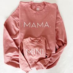 Mommy and Me Mauve Pullover Set. Get cozy with mom and kid. You can match with mauve for a girl mom matching or add your boy with our sea foam green that pairs so perfectly with the mauve.  Unisex sizing: 50/50 cotton/poly ---How To Order --- 1-) Choose your shirt size and color (adult sizes are Mama, Child sizes Mini) 2-) Click add to cart. You can go back to add more product 3-)Click "Proceed to check out" Unisex Shirts are unisex sizing. Women size down for a more fitted look.  ---Production Family Matching Cotton Tops For Loungewear, Matching Cotton Tops For Loungewear, Family Matching Pink Tops For Fall, Long Sleeve Tops With Name Print For Family, Long Sleeve Tops For Mother's Day Loungewear, Family Matching Loungewear Tops With Relaxed Fit, Casual Tops With Name Print For Loungewear, Casual Pink Sweatshirt For Mother's Day, Matching Long Sleeve Tops For Mother's Day