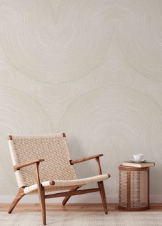 a chair and side table in front of a wallpapered background with wavy lines