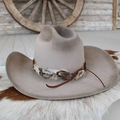 The Willow feather hat band is constructed of primarily cream feathers layered with brown and iridescent feathers.     Width: 3 cm  Length: approx. 58cm (not including leather ties)  One size fits most. Adjustable with leather ties. Hat not included.  CA Residents: Prop 65 Warning ↗️ Feather Hat Band, Iridescent Feathers, Feather Hat, Toddler Boots, Long Sleeve Kids, Pets For Sale, Boys Bottoms, Cowboy Boots Women, Boys Pajamas