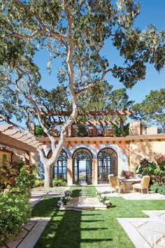 an outdoor patio with grass and trees