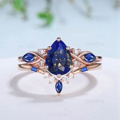 a ring with blue and white stones on it