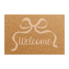 a welcome mat with a bow on the front and words that say,'welcome '