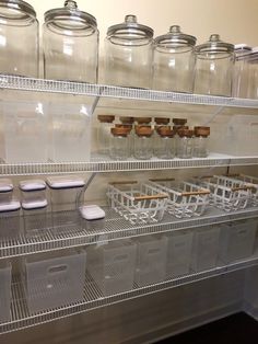 the shelves are filled with clear plastic containers