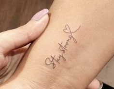 a woman's foot with a tattoo on it that says, thank you written in cursive writing