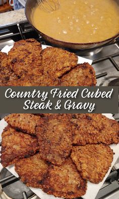 some fried meat and gravy on a plate with a bowl of gravy in the background