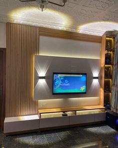 a living room with a flat screen tv mounted to the wall