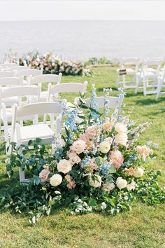 Blush, pink and blue flowers adorn a wedding ceremony on a hot summer day at Pelham House Resort on Cape Cod Floral Arch Arrangements, Ground Floral Arrangements Wedding, Pastel Wedding Arch, Grounded Floral Arches, Cape Cod Wedding Flowers, Spring Wedding Flowers Centerpieces, Lobster Boil, Blue And Blush Wedding, Summer Wedding Ceremony