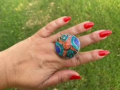 This listing is for 1 piece. At wholesale price Large Tibetan Rings with Turquoise, Coral & Lapis Inlay is absolutely stunning with beautiful adjustable band. You will receive the exact ring shown in the pictures.This high quality durable statement piece ring is handmade in Nepal. Beauty of this ring that is unmatched as they are handmade and are one of a kind. With the nature of them being handmade, each product is unique in its own right and no two products are the exact same. Made with Ti Nepal Beauty, Tribe Jewelry, Tibetan Ring, Natural Stone Earrings, Ring Turquoise, Gemstone Stud Earrings, Feather Pendant, Women Ring, Ethnic Jewelry