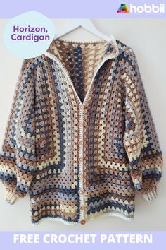 a crocheted jacket is hanging on a hanger with the text horizon, cardigan