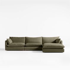 a large sectional couch sitting on top of a white floor