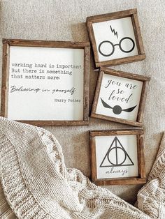 three harry potter framed signs on a couch