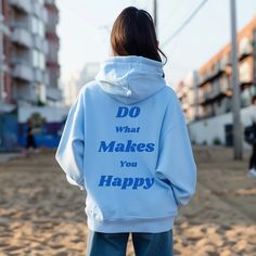 Step into the comfort of self-expression with our "Do What Makes You Happy" hoodie, where every stitch embodies the spirit of personal freedom. Crafted from the finest cotton blend, it wraps you in warmth and softness, perfect for leisurely days or moments of introspection. Whether you're lounging at home, exploring the city streets, or catching up with friends, this hoodie is your faithful companion, effortlessly blending style and motivation. Available in a spectrum of vibrant colors to suit every mood, each hoodie is designed for a relaxed fit that flatters every silhouette. The hood provides an extra layer of comfort and coziness, while the kangaroo pocket offers convenience and practicality. .: Made with a medium-heavy fabric that consists of 50% cotton and 50% polyester for that cozy Fun Hoodie Sweatshirt With Drawstring Hood, Fun Sweatshirt With Drawstring Hood, Funny Hooded Sweatshirt With Letter Print, Fun Hooded Hoodie With Letter Print, Fun Letter Print Hoodie For Streetwear, Fun Hoodie With Letter Print For Streetwear, Fun Hoodie With Letter Print, Funny Hooded Hoodie For Streetwear, Fun Winter Hoodie With Letter Print