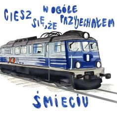 a blue and white train traveling down tracks next to the words smile on it's side