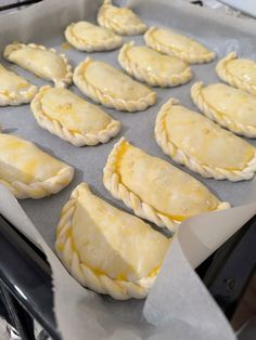 there are many pastries in the pan on the stove top, ready to be baked