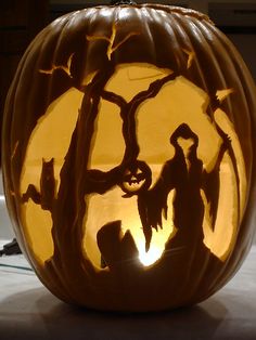 a carved pumpkin sitting on top of a table