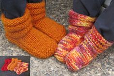 two pairs of knitted slippers sitting next to each other on top of a stone floor