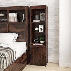 a bedroom with a bed, night stand and bookcase on the wall next to it