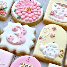 some decorated cookies are sitting on a table