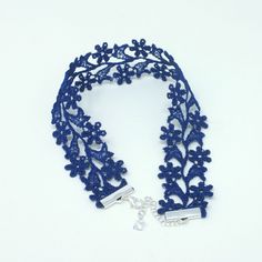 Rock the neck-flattering Zara Royal Blue Wide Choker on a special occasion or whenever you want to add a touch of elegance and sensuality to your outfit. Two rows of royal blue dainty flowers are embroidered together to form this 1-inch wide floral choker. It is soft and flexible making it easy to wear and enjoy all day. This dainty royal blue wide choker will be a classy and sophisticated addition to many different outfits. Lightweight, wear-resistant design Blends it well with other jewelry it Blue Summer Choker As A Gift, Blue Choker As Summer Gift, Summer Blue Choker As Gift, Summer Gift Blue Choker, Spring Party Blue Jewelry, Floral Choker For Spring Parties, Flower Shaped Choker For Spring Party, Elegant Blue Choker For Wedding, Summer Party Flower Shaped Choker