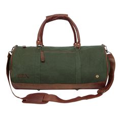 Materials: 100% cotton canvas and full grain leather exterior. 100% cotton lining interior. Dimensions: W53cm x H28cm x D28cm, handle: L66cm W3.8cm, extendable shoulder strap: L78cm-L145cm. Hardware: Brass fittings and robust YKK zippers. Features: Extendable detachable shoulder strap, inside zip pocket, outside zip pocket, leather clip on the grab handles for comfortable grip, four brass studs on the leather base. Combining great styling with rugged practicality, our Gym Duffle in Green Canvas Green Duffle Bag, Boho Tote Bag, Boho Tote, Leather Weekender Bag, Gym Gear, Weekend Bag, Mahi Mahi, Leather Luggage, Unisex Accessories