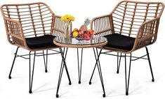 two chairs and a table with fruit on it are shown in front of a white background