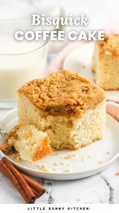 a piece of coffee cake on a plate with cinnamon sticks and milk in the background