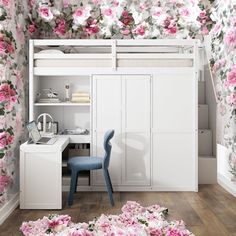 a bedroom with flowers on the wall and desk